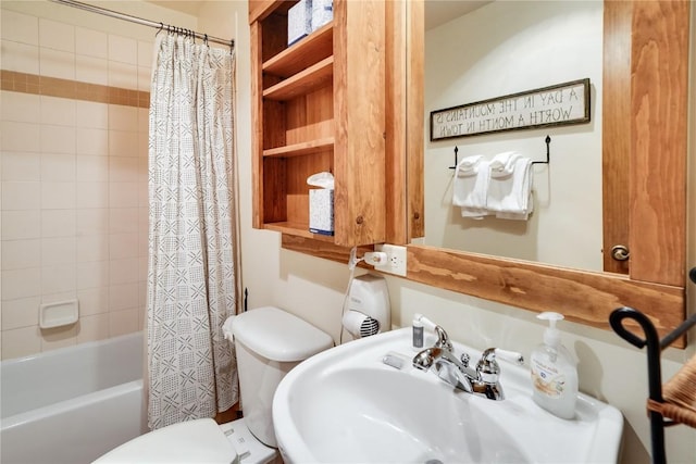 full bathroom with a sink, shower / bathtub combination with curtain, and toilet