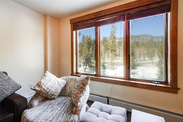 sitting room featuring baseboard heating