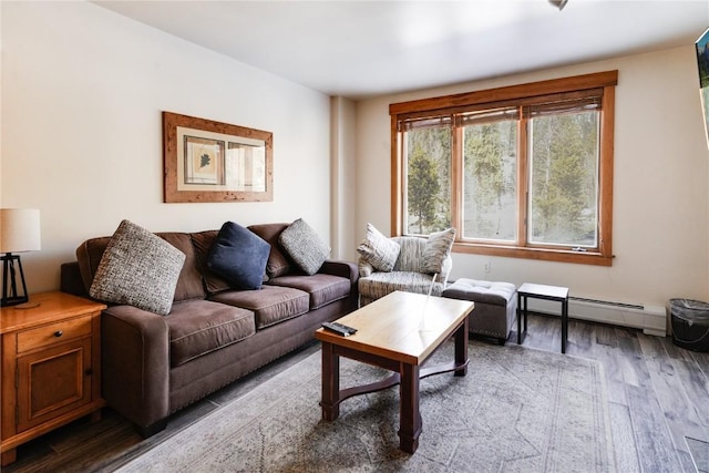 living room featuring a baseboard heating unit and wood finished floors