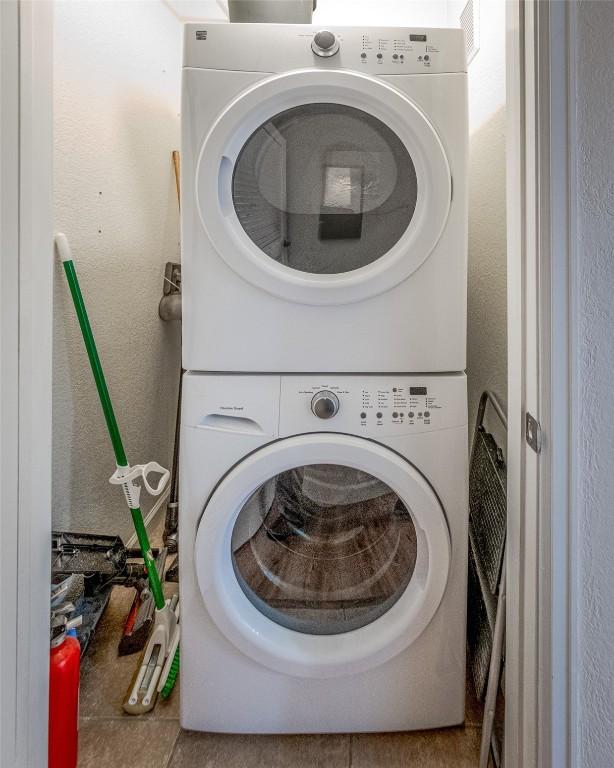 1458 Morgan Ct Unit 1603, Steamboat Springs, CO 80487 - laundry room featuring stacked washer and clothes dryer