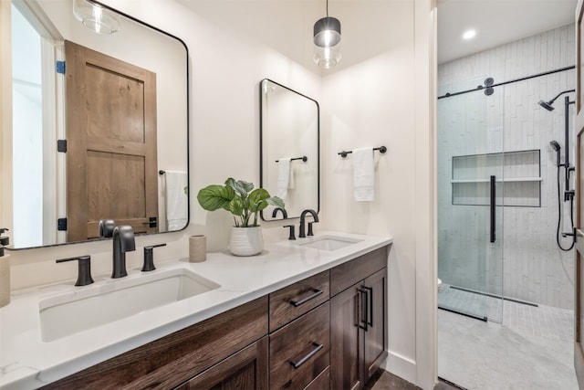 18 Heather Way, Silverthorne, CO 80498 - bathroom with a tile shower, double vanity, and recessed lighting