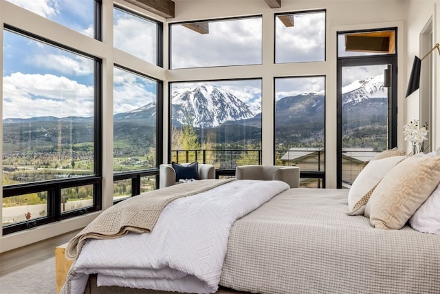 18 Heather Way, Silverthorne, CO 80498 - bedroom featuring a mountain view and wood finished floors