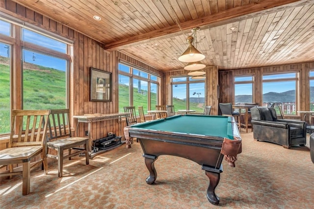 game room with wood walls, wooden ceiling, pool table, and a mountain view