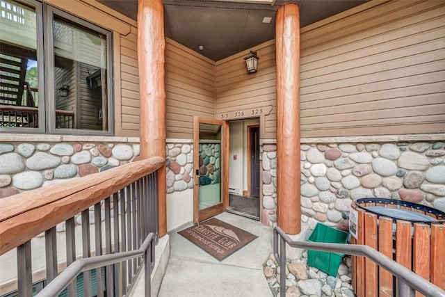 view of exterior entry with stone siding
