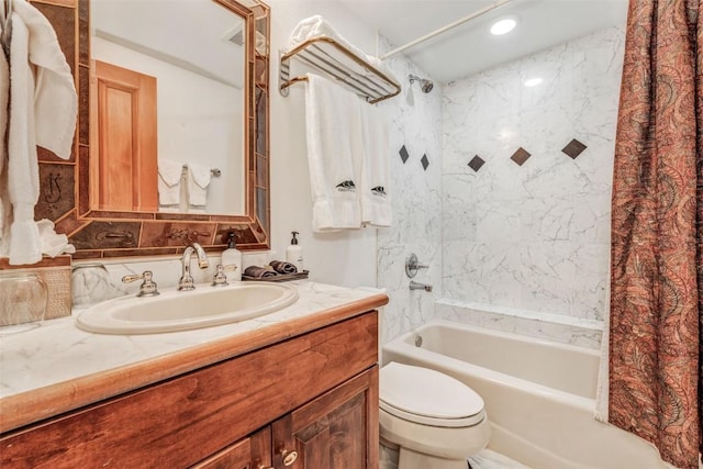 full bathroom featuring shower / bath combo with shower curtain, toilet, and vanity