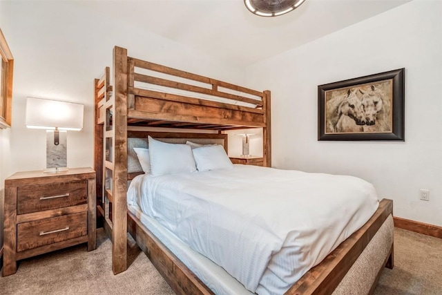 carpeted bedroom with baseboards
