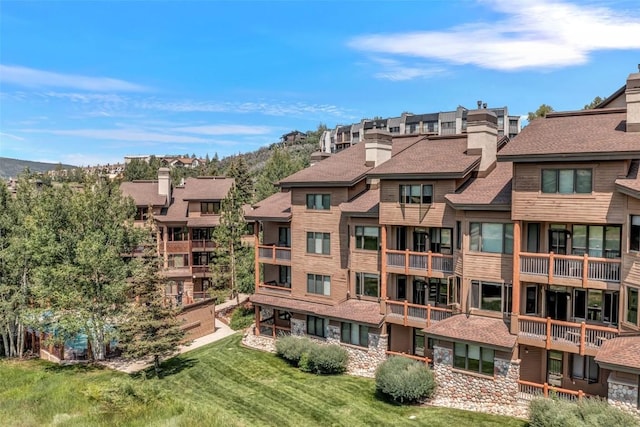 view of property featuring a residential view and a mountain view