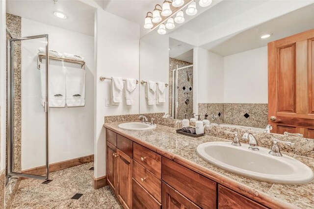 bathroom featuring a bath, a sink, double vanity, and a stall shower