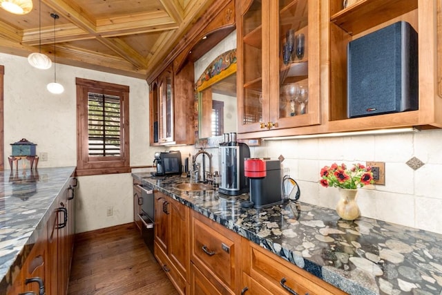 1031 Steamboat Blvd, Steamboat Springs, CO 80487 - kitchen with coffered ceiling, dark wood-style floors, brown cabinetry, glass insert cabinets, and backsplash