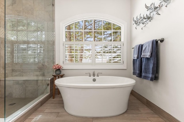 1031 Steamboat Blvd, Steamboat Springs, CO 80487 - full bath with a freestanding tub, wood finished floors, and a shower stall
