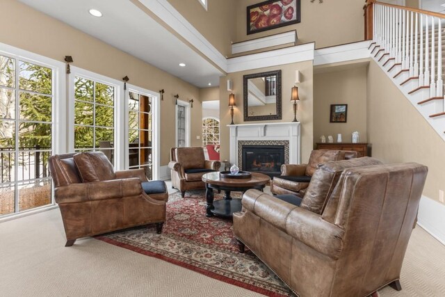 1031 Steamboat Blvd, Steamboat Springs, CO 80487 - living room with stairway, a glass covered fireplace, a barn door, and recessed lighting