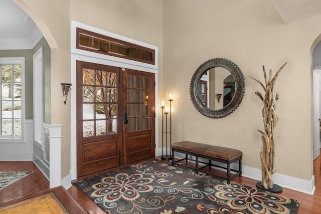1031 Steamboat Blvd, Steamboat Springs, CO 80487 - entrance foyer with arched walkways, crown molding, wood finished floors, and french doors
