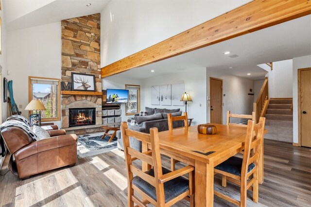119 Royal Tiger Rd, Breckenridge, CO 80424 - dining space with wood finished floors, a fireplace, stairway, and recessed lighting