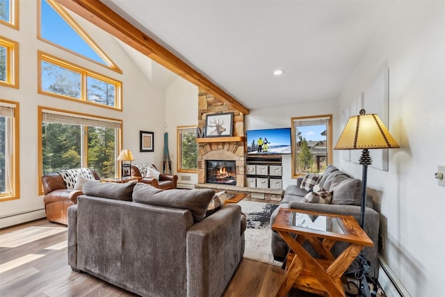 119 Royal Tiger Rd, Breckenridge, CO 80424 - living area featuring wood finished floors, a baseboard radiator, a fireplace, recessed lighting, and high vaulted ceiling