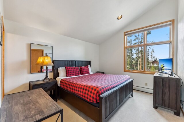 119 Royal Tiger Rd, Breckenridge, CO 80424 - bedroom with a baseboard heating unit, vaulted ceiling, and light colored carpet