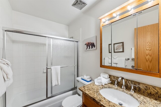 119 Royal Tiger Rd, Breckenridge, CO 80424 - bathroom featuring bath / shower combo with glass door, vanity, and toilet