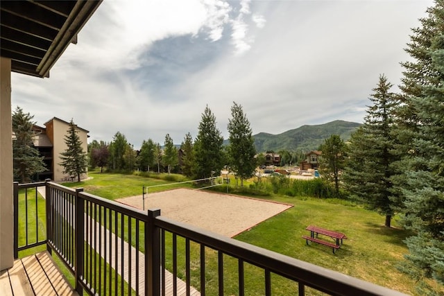 balcony with volleyball court and a mountain view