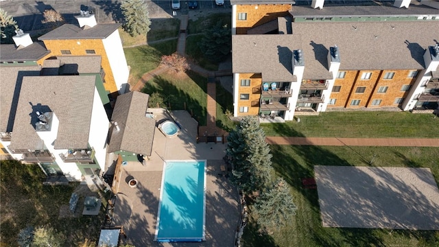 birds eye view of property with a residential view