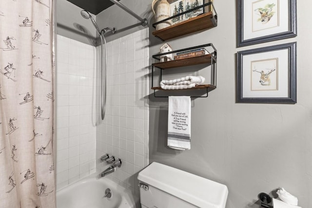bathroom featuring shower / bath combo with shower curtain and toilet