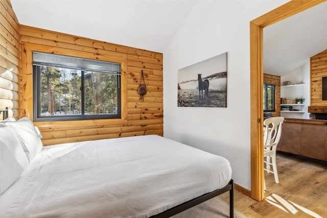1937 Soda Ridge Rd Unit 1146, Keystone, CO 80435 - bedroom featuring vaulted ceiling, wood finished floors, and rustic walls
