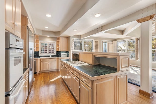 kitchen with light wood-style floors, light brown cabinetry, white appliances, and open shelves