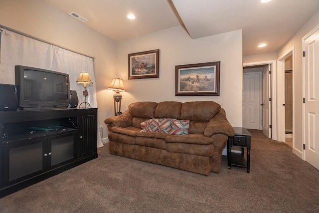 living room featuring carpet floors, visible vents, and recessed lighting