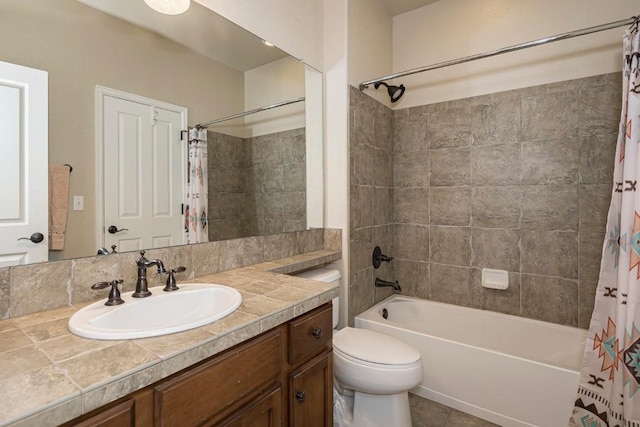 full bath with shower / tub combo with curtain, tile patterned flooring, vanity, and toilet