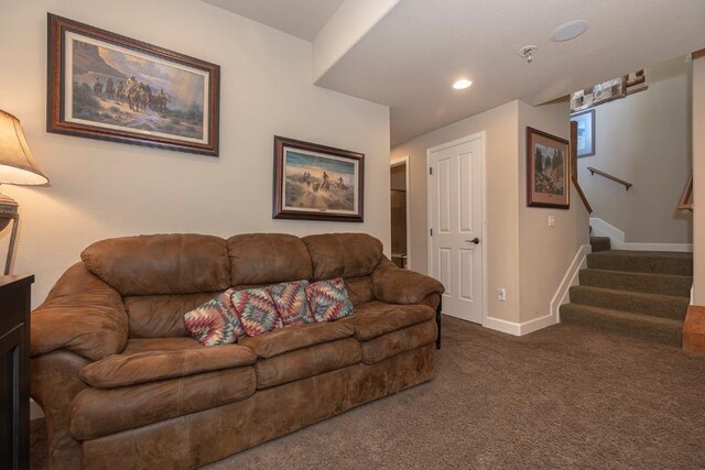 carpeted living room featuring baseboards, recessed lighting, and stairway