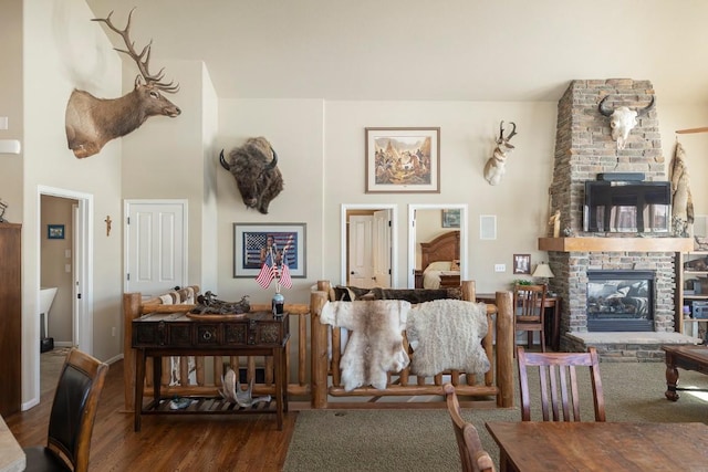 living area with wood finished floors and a fireplace