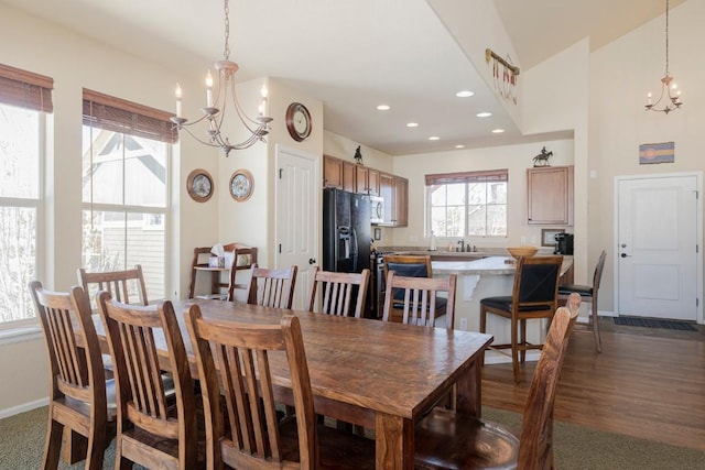 dining room with baseboards, a notable chandelier, dark wood-style floors, and recessed lighting