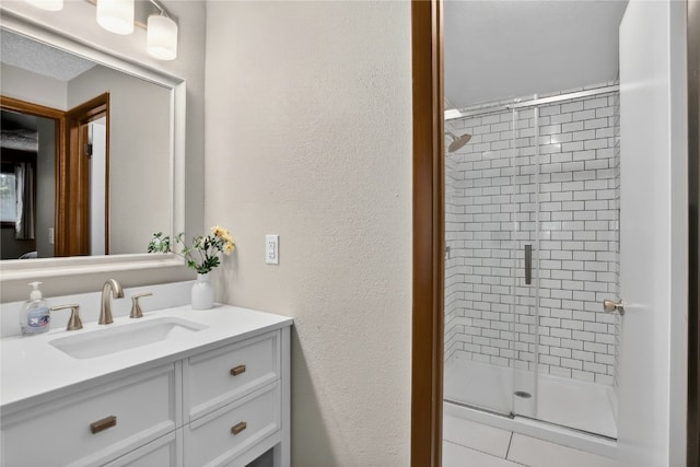 24 Ski Pole Ct, Breckenridge, CO 80424 - full bath with a shower stall, vanity, and a textured wall
