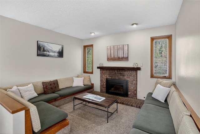 24 Ski Pole Ct, Breckenridge, CO 80424 - living room featuring healthy amount of natural light, a brick fireplace, carpet floors, and a textured ceiling