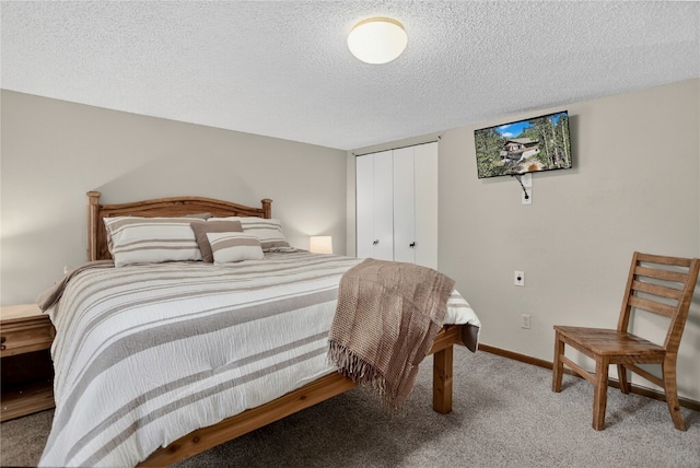 24 Ski Pole Ct, Breckenridge, CO 80424 - bedroom featuring light colored carpet, a closet, and a textured ceiling