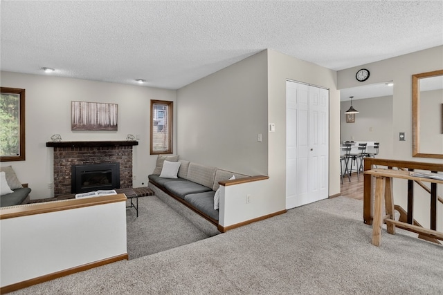 24 Ski Pole Ct, Breckenridge, CO 80424 - carpeted living area featuring a textured ceiling and a brick fireplace