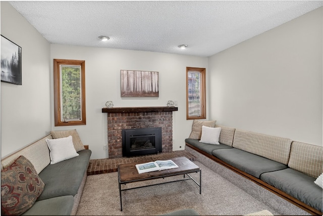 24 Ski Pole Ct, Breckenridge, CO 80424 - carpeted living area featuring a brick fireplace and a textured ceiling