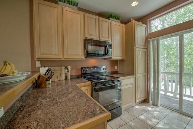 102 Creek Ln Unit 102, Silverthorne, CO 80498 - kitchen with black appliances, light brown cabinets, light tile patterned flooring, and recessed lighting
