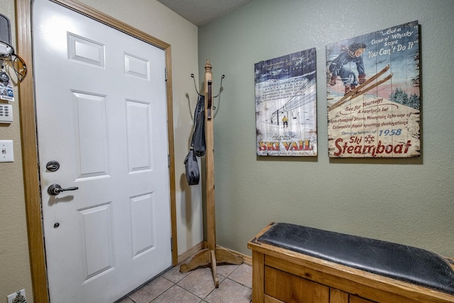 102 Creek Ln Unit 102, Silverthorne, CO 80498 - foyer entrance featuring light tile patterned flooring and baseboards