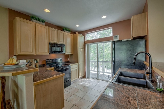 102 Creek Ln Unit 102, Silverthorne, CO 80498 - kitchen featuring black appliances, light brown cabinets, tile countertops, a peninsula, and recessed lighting