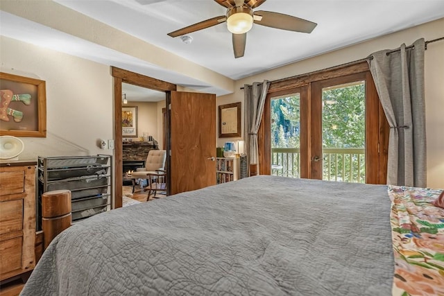 bedroom with a ceiling fan and access to outside