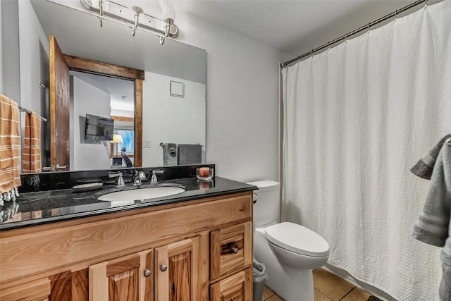 full bathroom with vanity, toilet, a shower with curtain, and tile patterned flooring