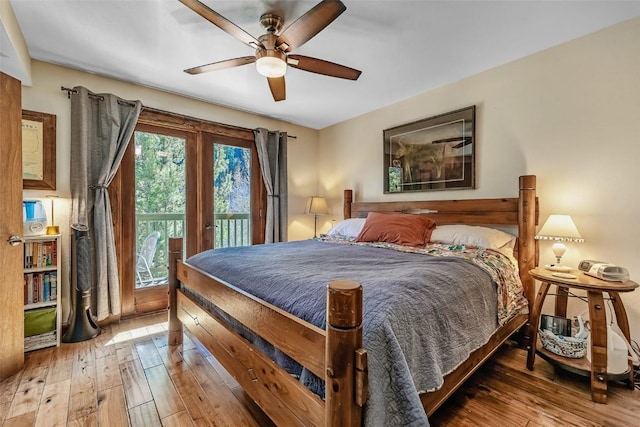 bedroom featuring access to exterior, hardwood / wood-style flooring, and ceiling fan
