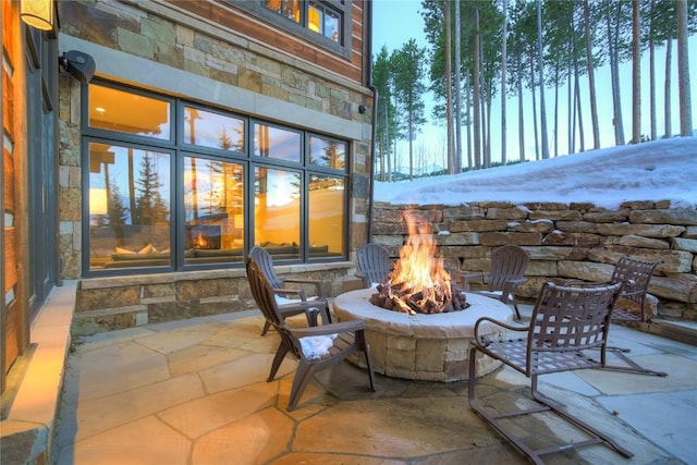 422 Timber Trail Rd, Breckenridge, CO 80424 - patio terrace at dusk featuring a fire pit