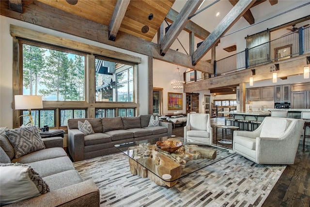 422 Timber Trail Rd, Breckenridge, CO 80424 - living area featuring high vaulted ceiling, beam ceiling, wood finished floors, and a chandelier