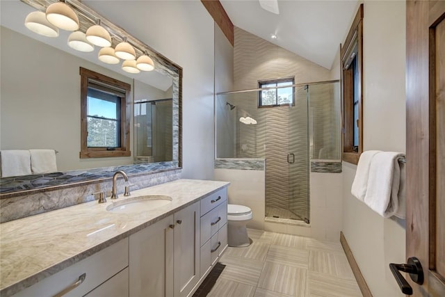422 Timber Trail Rd, Breckenridge, CO 80424 - bathroom featuring a shower stall, vanity, tile patterned floors, toilet, and lofted ceiling