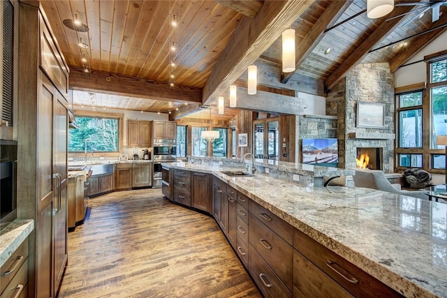 422 Timber Trail Rd, Breckenridge, CO 80424 - kitchen featuring a sink, wood ceiling, wood finished floors, and a wealth of natural light