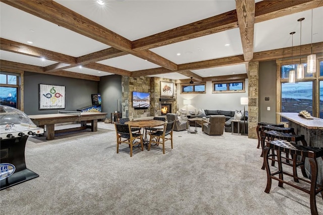 422 Timber Trail Rd, Breckenridge, CO 80424 - carpeted dining space with beamed ceiling, a stone fireplace, and coffered ceiling