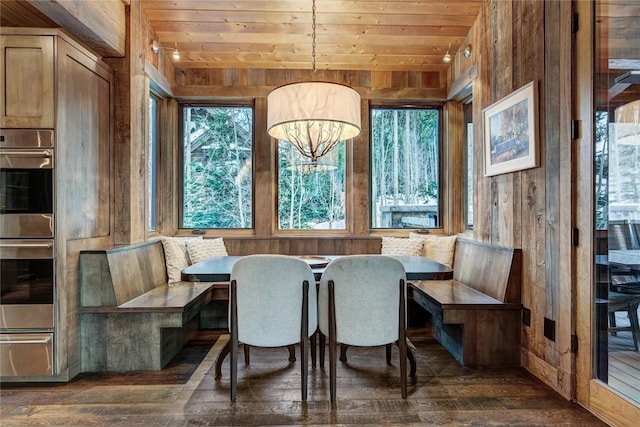 422 Timber Trail Rd, Breckenridge, CO 80424 - dining space with wood walls, wooden ceiling, and hardwood / wood-style floors