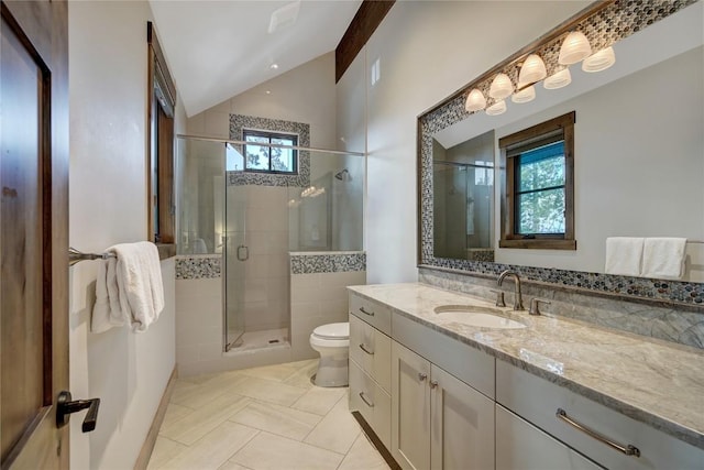422 Timber Trail Rd, Breckenridge, CO 80424 - full bath featuring tile patterned flooring, vanity, toilet, a shower stall, and vaulted ceiling