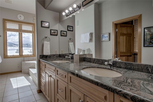 1235 Elk Run Rd, Silverthorne, CO 80498 - full bath featuring double vanity, tile patterned flooring, tiled tub, and baseboards