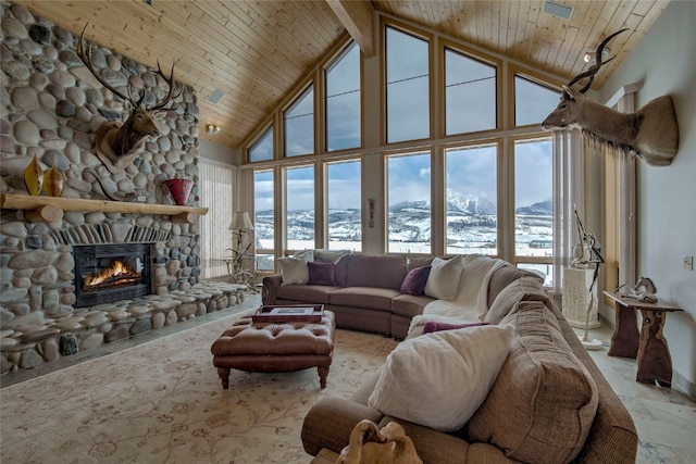 1235 Elk Run Rd, Silverthorne, CO 80498 - living room featuring high vaulted ceiling, a mountain view, a fireplace, and wooden ceiling with exposed beams